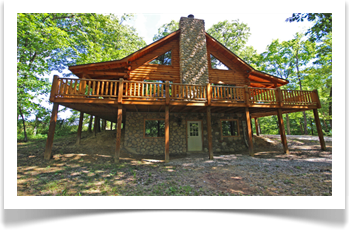 lodge, wrap porch. tall trees, windows and bottom door