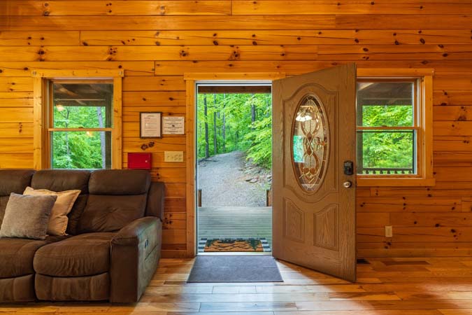 Covered porch with an oval glass door