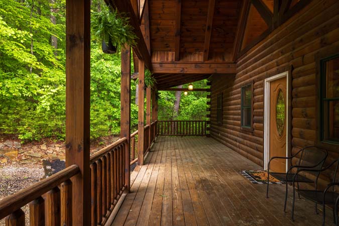 Covered wraparound deck overlooking the woods