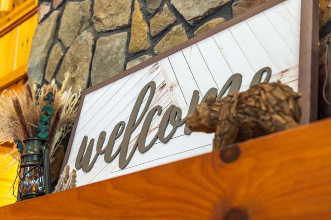 Welcome details by the stone fireplace