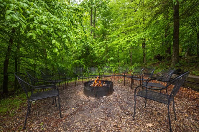 Outdoor firepit ringed with chairs
