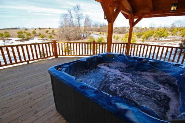 Closeup of Hot Tub 1 on West Main Deck, looking Northwest, with rolling hills and some trees
