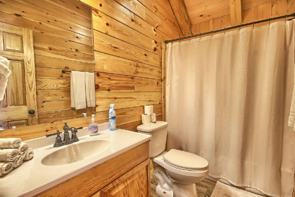 Full Bathroom 3, on loft level, with Tub and Shower, Toilet, Sink and Large Mirror, Tile Floor