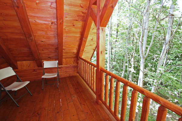 Back of Third-Floor Deck, showing two chairs, with Railing and Woods to the Right