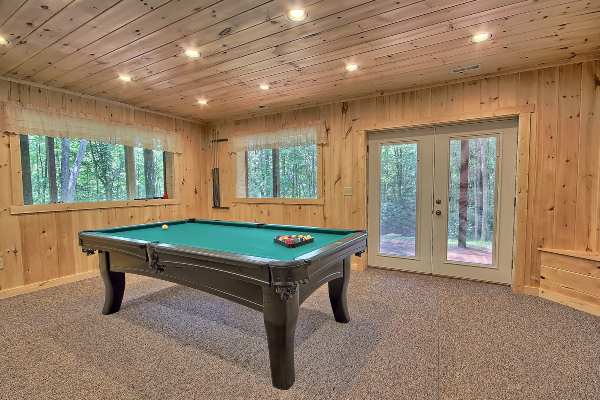 Pool Table from the South side, showing large picture windows on West Wall and North Wall along with the Walkout Door.