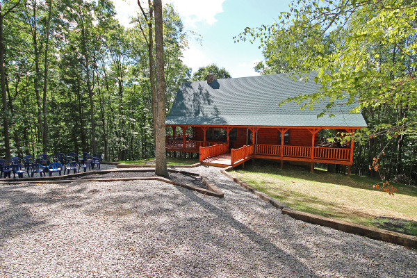 Longer Southeast View of Landscaping, Gravel Walkway, with Fire Pit Area to the left, and Ramp and Lodge to right