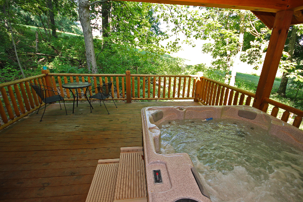 wooded view from hot tub on deck