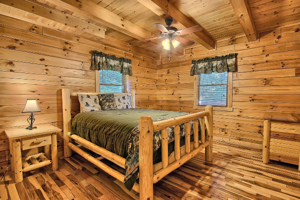 Private Bedroom 2, on main level, with Queen Bed, Dresser and Night Stand, two windows, Ceiling Fan, Hardwood Floor
