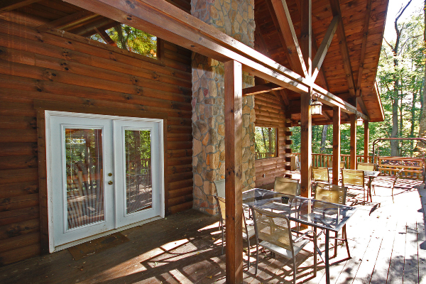 South Side Deck, with tables and chairs, side door and the Porch Swing
