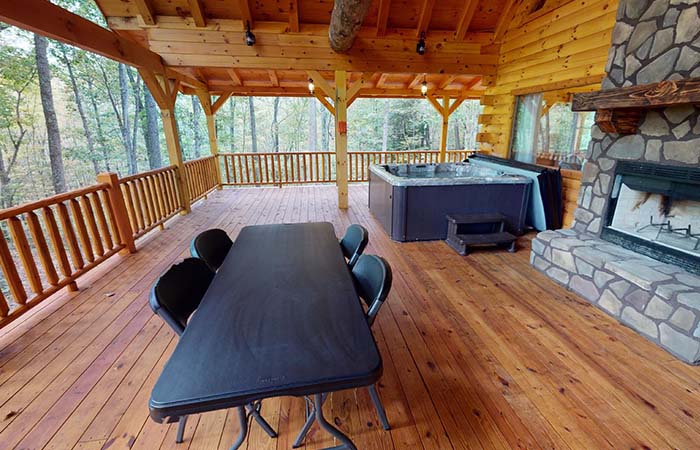 South woods from Eastside of Deck, with the folding table, fireplace, and hot tub